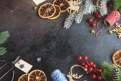 Christmas holiday concept, top view of holly and holiday items on table