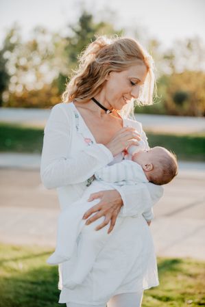 woman feeding a baby with a bottle