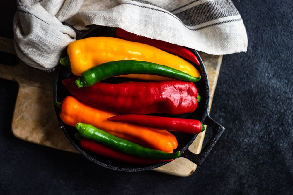 Top view of fresh raw bell peppers in a pan