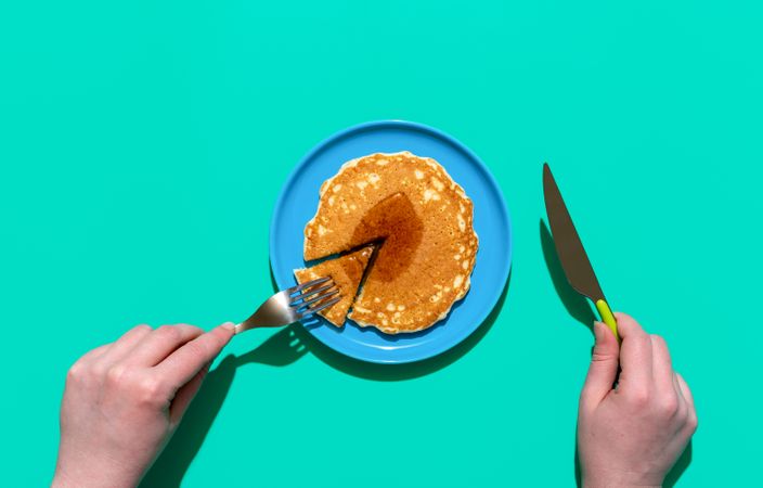 Pancake on a plate on minimalist on a green background