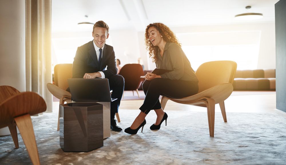 Man and woman in business casual working together