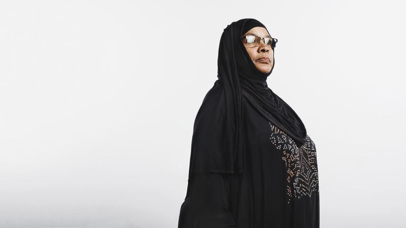 Muslim woman in hijab isolated on neutral background