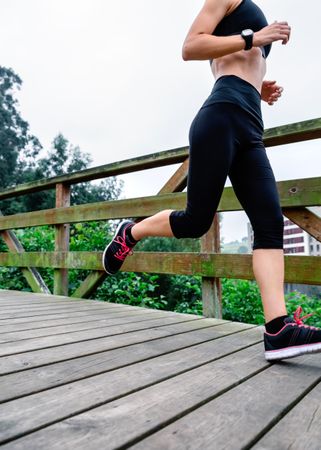 Woman running through an urban park