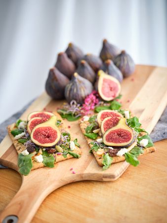 Arranged figs and served food placed on tray