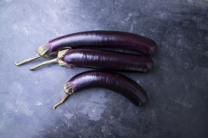 Fresh eggplant on a concrete Floor