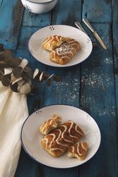 Homemade tasty sweet rolls on plates
