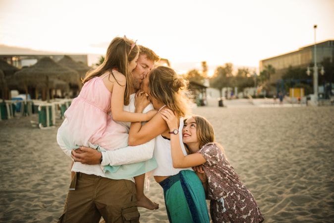 Beautiful happy family with children on beach