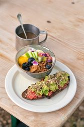 Healthy breakfast with muesli bowl and avocado toast