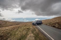 Car on road in hill terrain