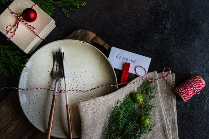 Top view of gift and plate on Christmas table