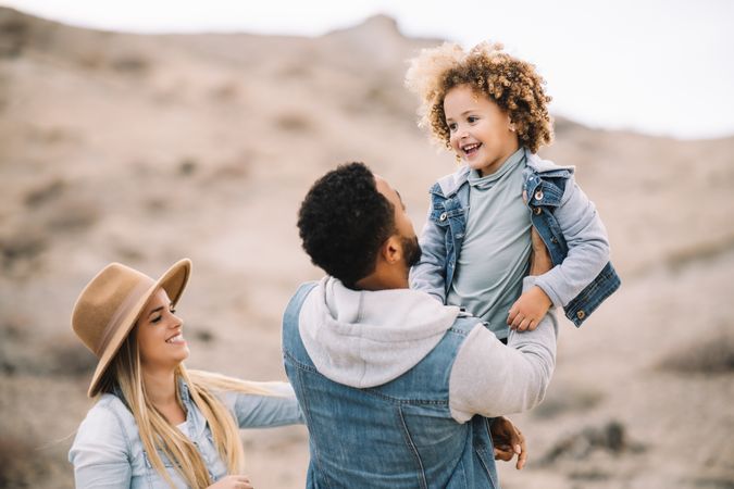 Happy multiethnic family gathering on nature