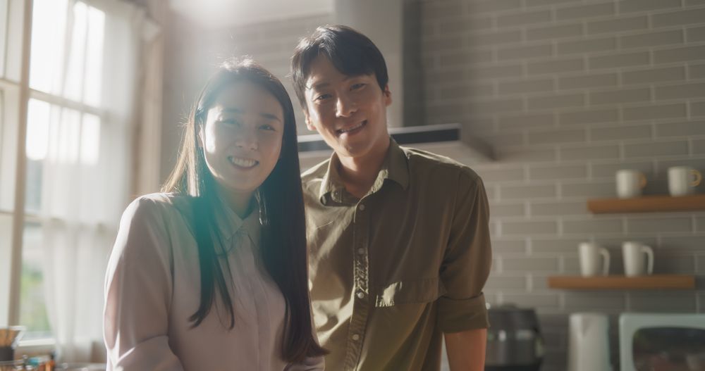 Asian Young Couple Cooking Delicious Food at Home.