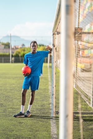 Black teenager on football field