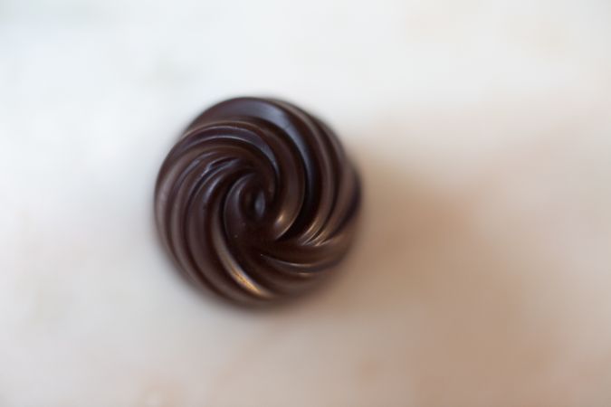 Delicious chocolate candy on table