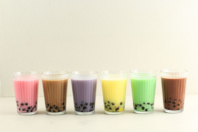 Row of colorful boba teas in studio space