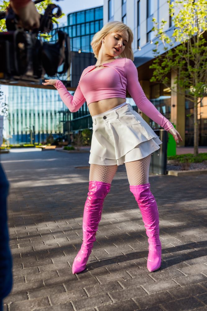 Behind The Scenes Photo With Young Female Vogue Dancer Performing Her Choreography On Modern City Street.