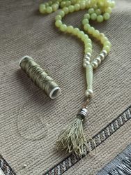 Green and pearly praying beads with green strings