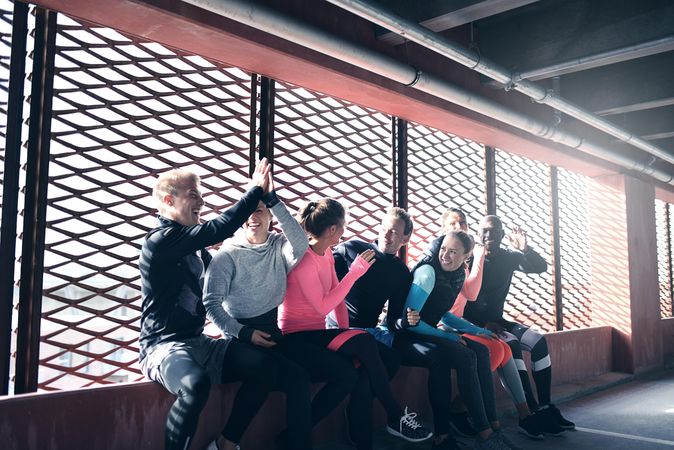 Group of people hanging out and congratulating themselves after a workout