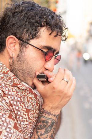 Portrait of Latin Musician playing the harmonica