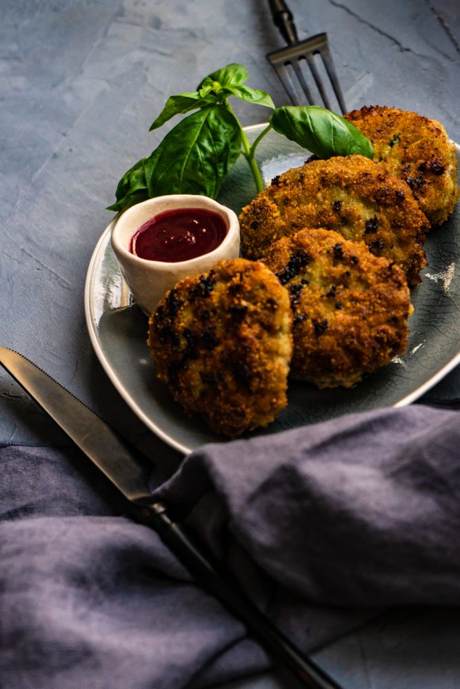 Pork cutlets served with fresh basil