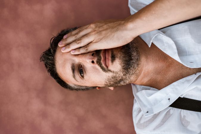 Peaceful man resting in water at seaside