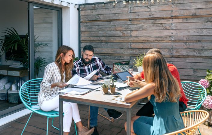 People working on the terrace of the office