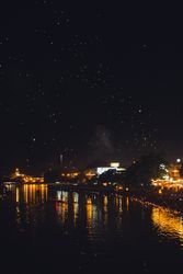 Sparks of burning fires on city seafront