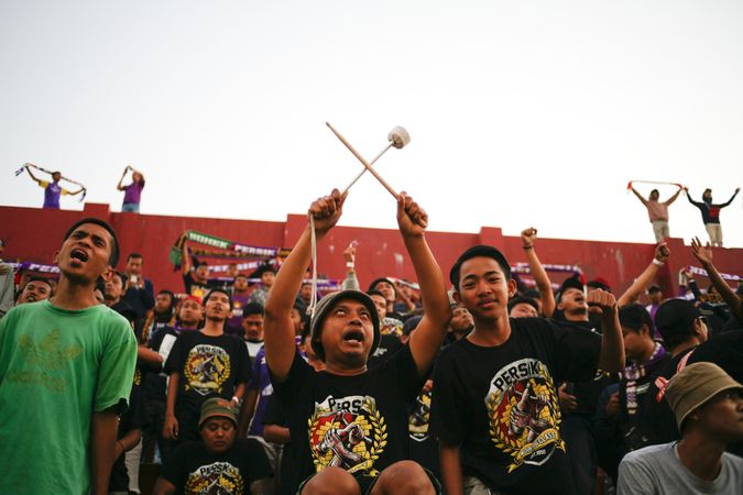 Kedira, East Java Indonesia - October 4, 2019: Fan calling out during soccer game