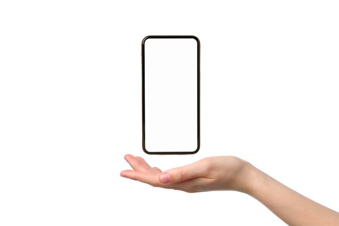A smartphone hovers above an open hand demonstrating a sleek design