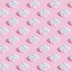 Bunny rabbits in rows on pink background