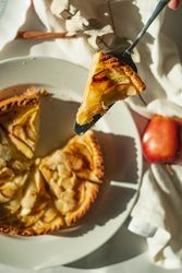 Apple tart slice on pie knife