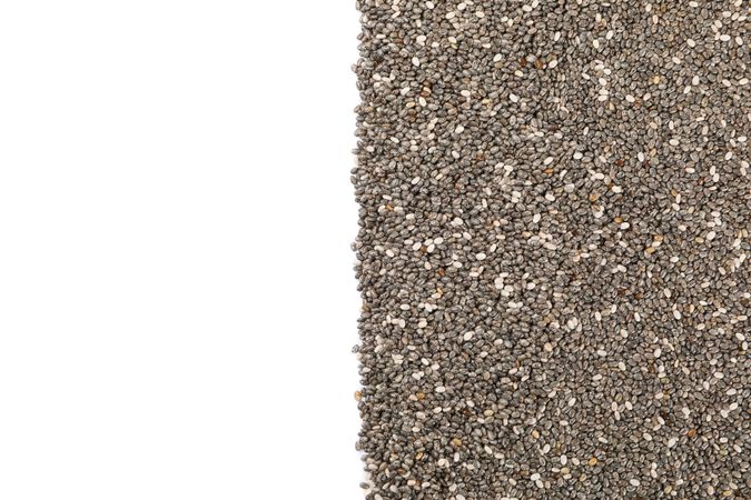 Chia seeds isolated on studio background, top view