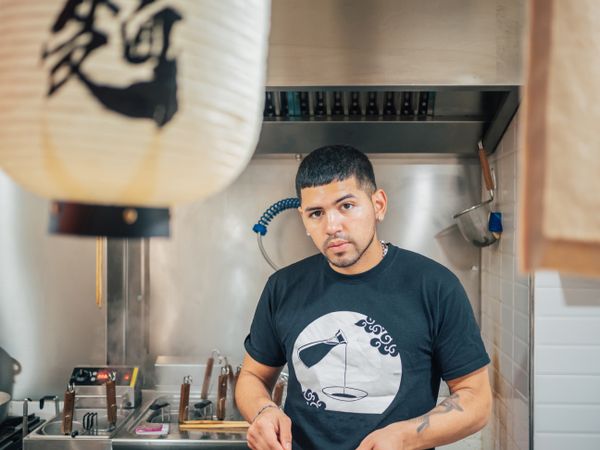 Handsome male cooking in kitchen