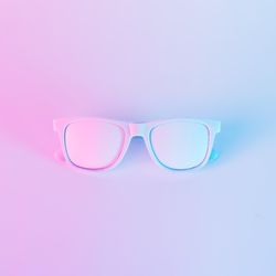 Sunglasses in vibrant bold gradient purple and blue holographic colors