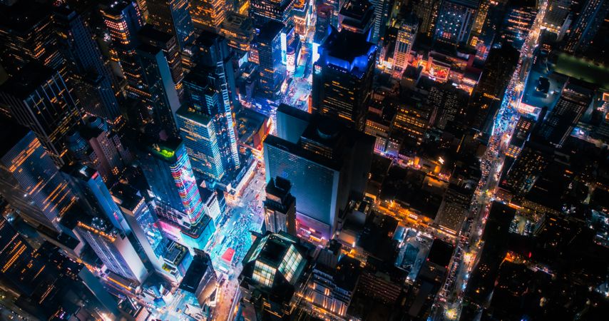 New York Concrete Jungle at Night. Aerial Shot from a Helicopter Tour Around Manhattan. Scenes with Modern Skyscraper Blocking the View on Crowded Times Square Area with Tourists