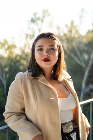 Portrait of pretty young Asian woman with classic makeup outside