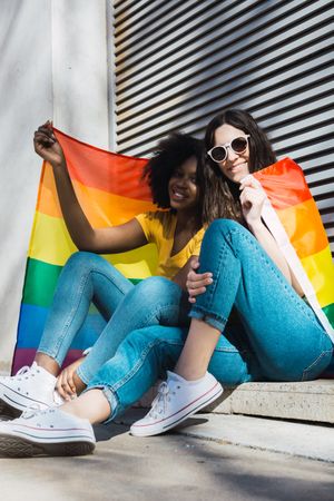 Lesbian couple with LGBT flag