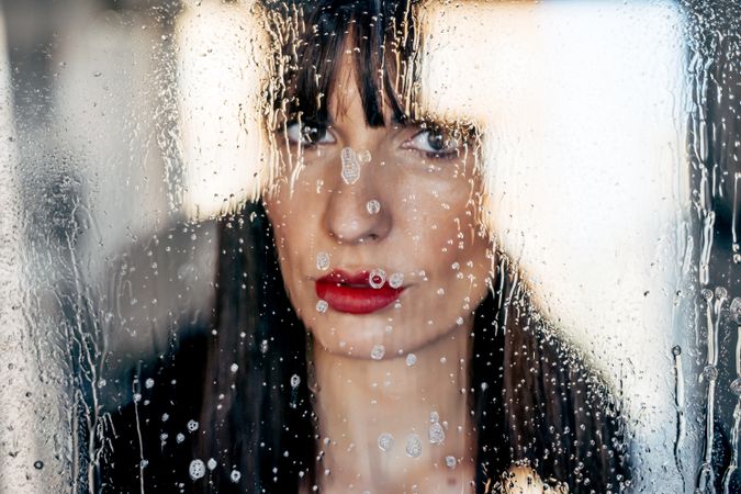Stylish woman kissing glass