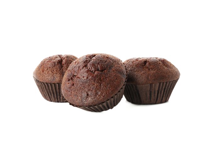 Delicious chocolate muffins isolated on blank background