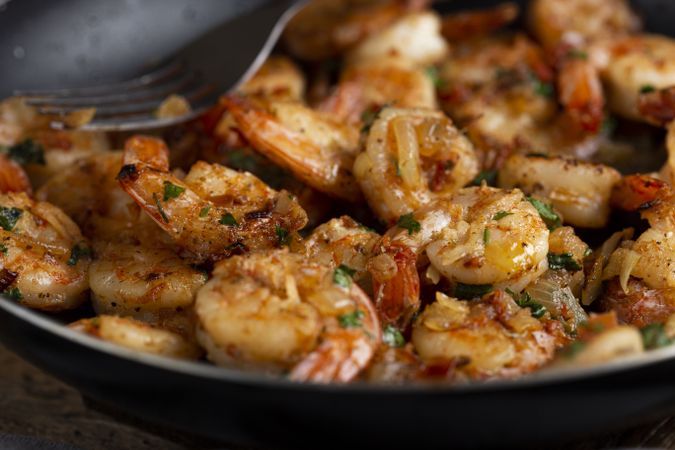 Delicious grilled prawns on wooden background.