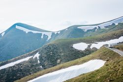 Caravan riding through snowy hills