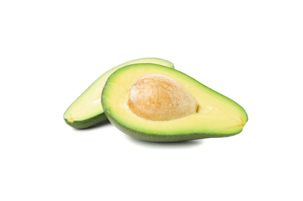 Ripe avocado halves isolated on blank background