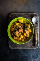 Georgian meat and vegetable dish Souzi served in green bowl