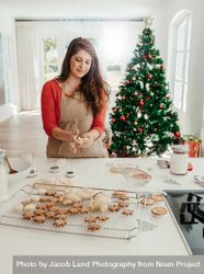 Woman preparing cookies for Christmas bGRWBA