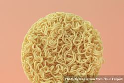 Circle of noodles on peach background 5oaJGb