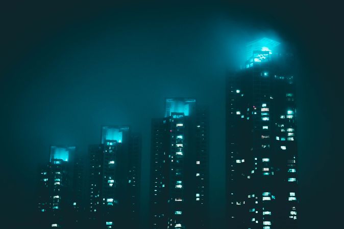 Identical high-rise buildings during nighttime