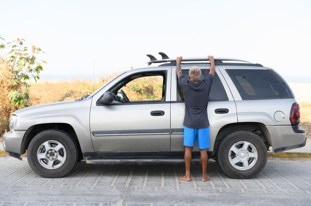 Anonymous woman standing near car