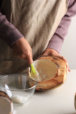 Female Hand Scooped Coconut Meat