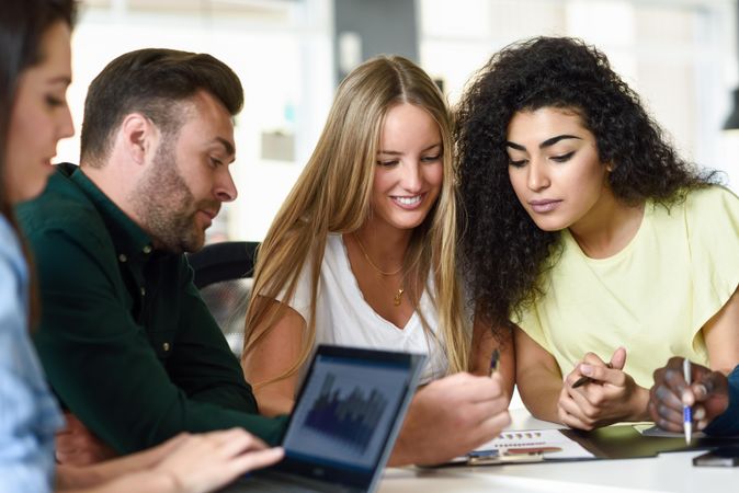 Four young people working together