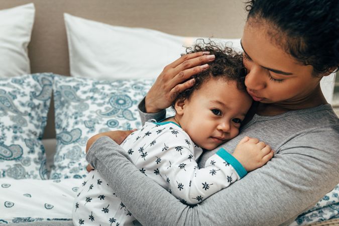 Mother holding baby to her chest